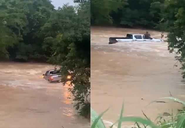 Caminhonete é levada pela força d’água e ocupantes ficam ilhados; veja vídeo