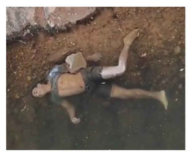 Homem é morto a tiros e jogado em rio junto com pedras em Cuiabá