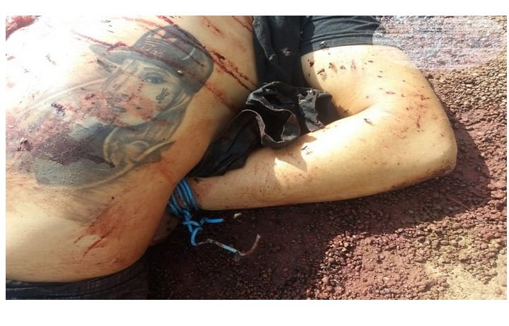 Jovem é encontrado morto com as mão amarada para trás em lixão. (Fotos)