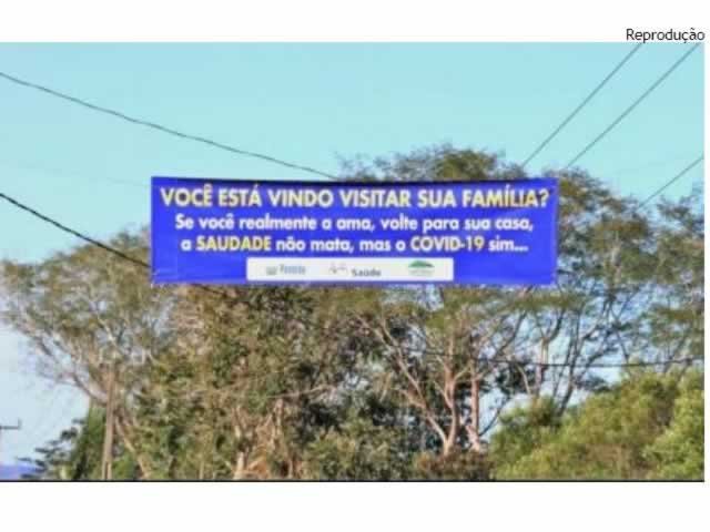 Faixa na entrada de cidade manda visitante voltar para casa: saudade não mata, a covid sim.